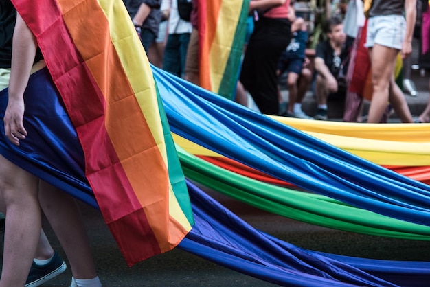 Gay pride parade concept of young people supporting the spread of equality Rainbow flags