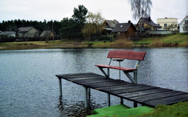 Gazebo by lake against building