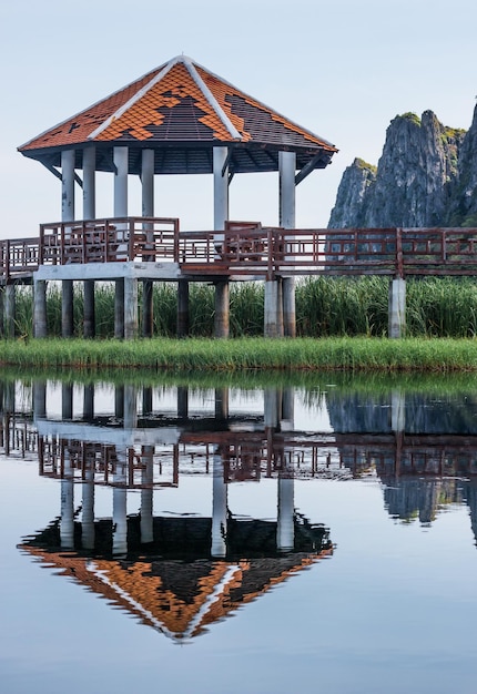 Gazebo by lake against sky