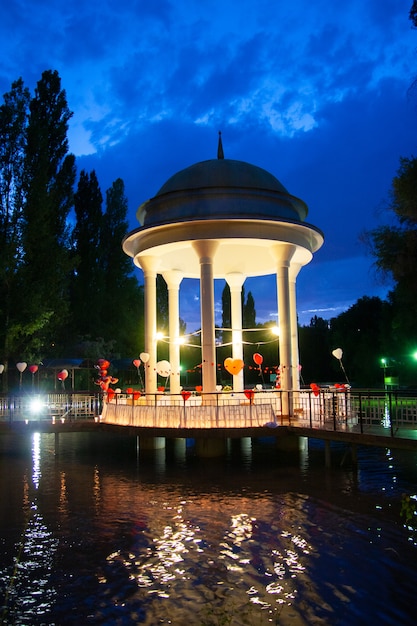 Gazebo in the middle of the lake at night