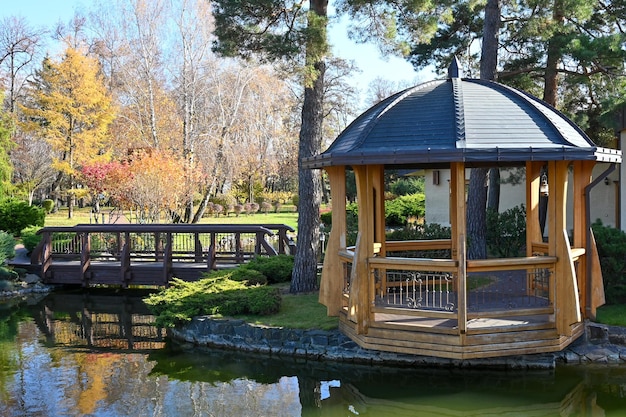 Gazebo and pedestrian bridge near the picturesque pond