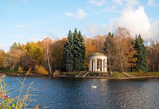 Gazebo-rotunda on the banks of the Swan pond in the autumn.