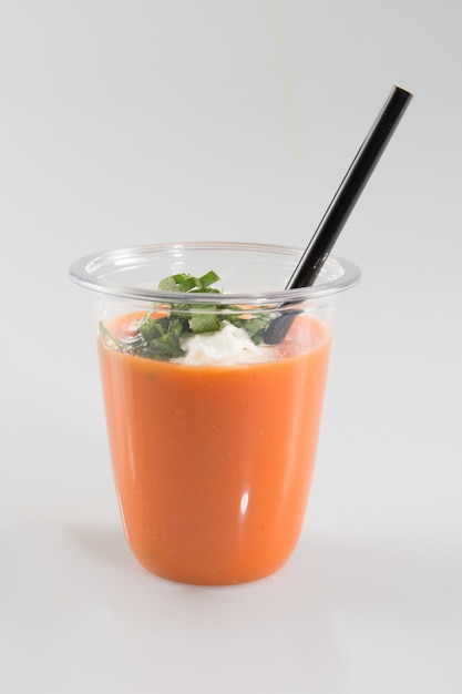 Gazpacho glass with small black straw