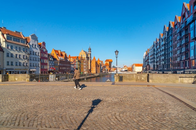 Gdansk Poland 11 March 2022 view of the city and the river Motlawa with a buildings on the embankment