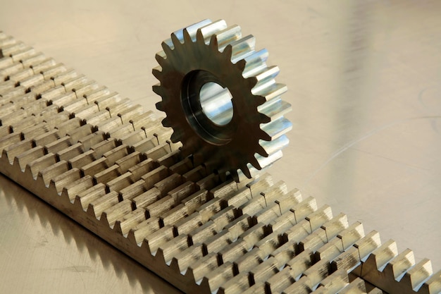 Gear wheel on rail Industrial background