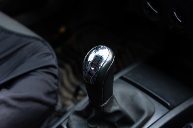 Gearbox knob in car close up in shadow