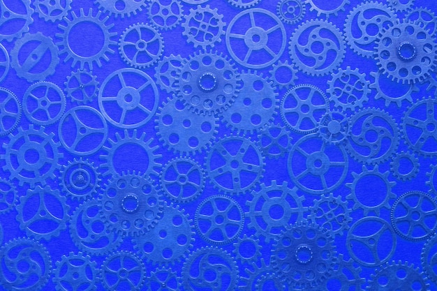 Gears, abstract background, lots of little gears with a blue tinge, steampunk.