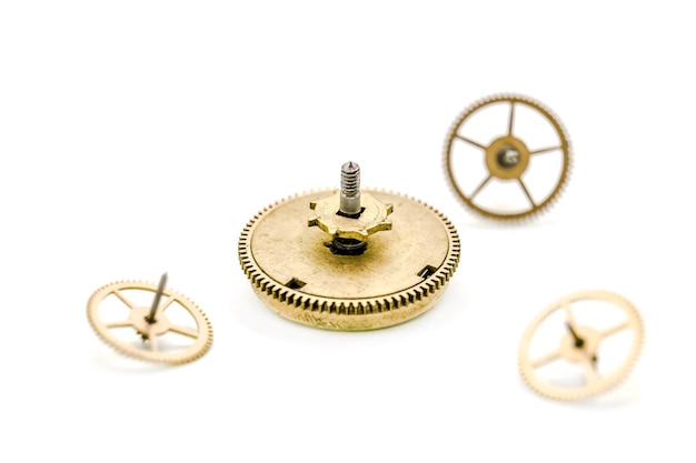 Gears from clock isolated on white background Photo with shallow depth of field