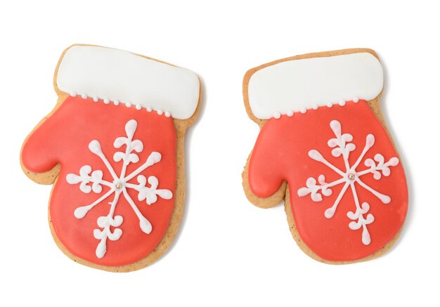 Gebakken peperkoek in de vorm van een want en bedekt met rood glazuur, een klassiek kerstdessert