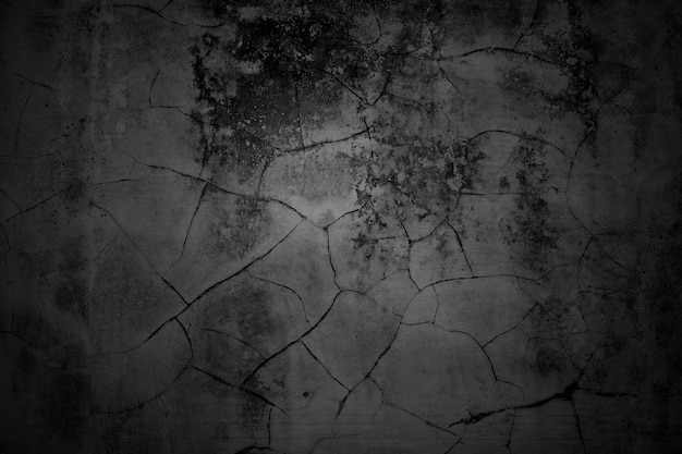 Gebarsten muren donkergrijze betonnen betonnen vloer is verouderd in een retro concept Textuur van een grungy zwarte betonnen muur als achtergrond