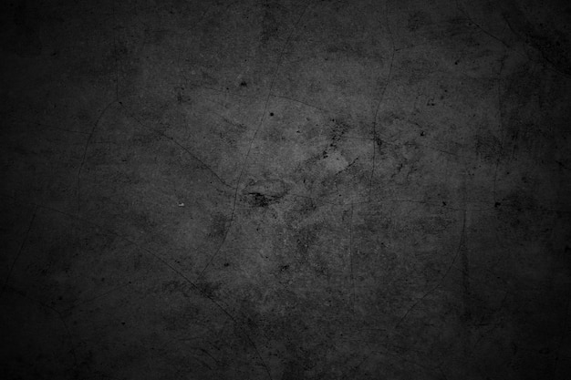 Gebarsten muren donkergrijze betonnen betonnen vloer is verouderd in een retro concept Textuur van een grungy zwarte betonnen muur als achtergrond