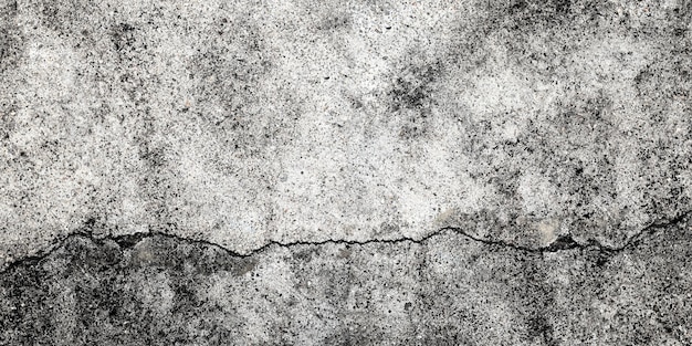 Foto gebroken betonnen muurvloer beschadigde muurachtergrond grijs grunge cementoppervlak met grote scheuren