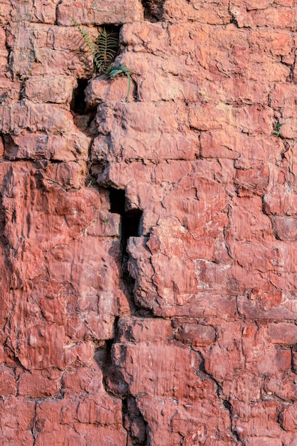 Gebroken oude bakstenen muur close-up shot