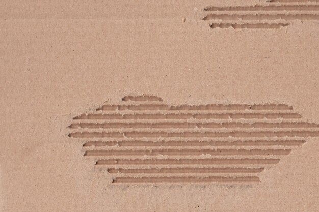 Foto gedetailleerde textuur van de achtergrond van oude karton