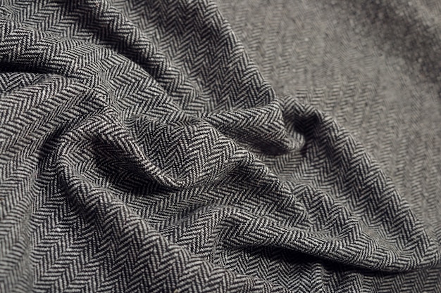 Gedrapeerde visgraat tweed wollen stof als achtergrondtextuur