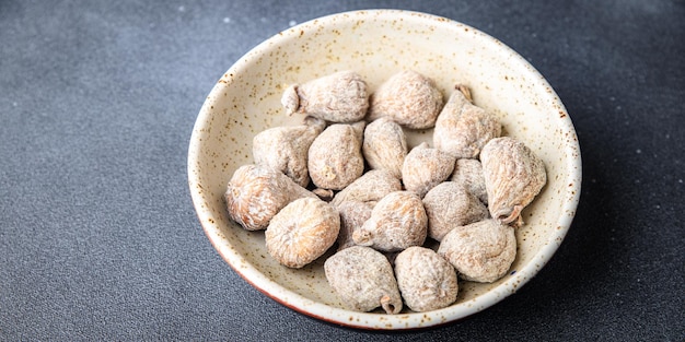 gedroogde vijgen natuurlijke snoepjes gedroogde vruchten maaltijd snack op tafel kopieer ruimte voedsel achtergrond