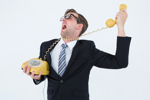 Geeky businessman being strangled by phone cord