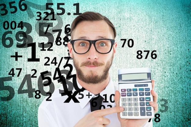 Photo geeky businessman pointing to calculator  against blue vignette background