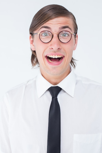 Geeky businessman smiling at camera