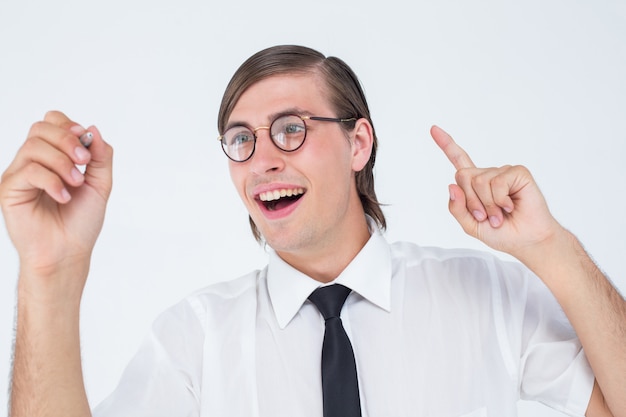 Geeky businessman writing with pen 