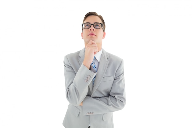 Geeky happy businessman thinking with hand on chin