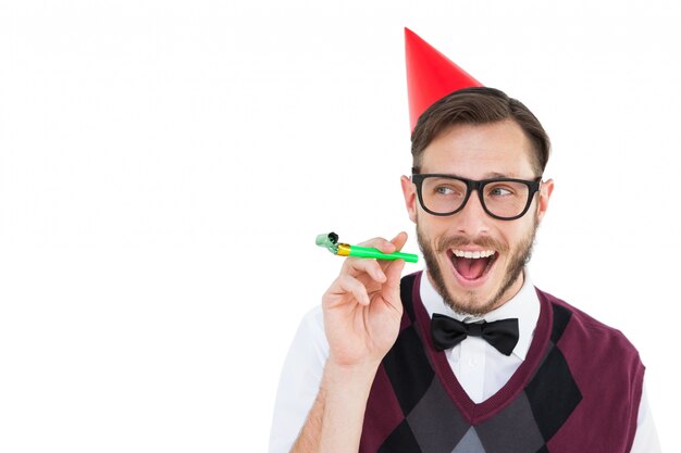 Geeky hipster in party hat with horn