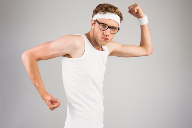 Geeky hipster posing in sportswear