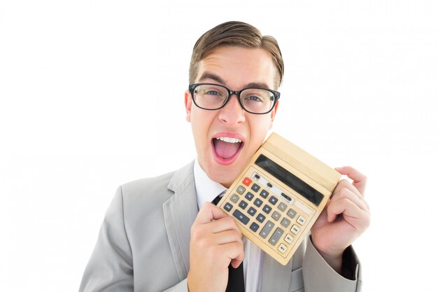 Geeky smiling businessman showing calculator