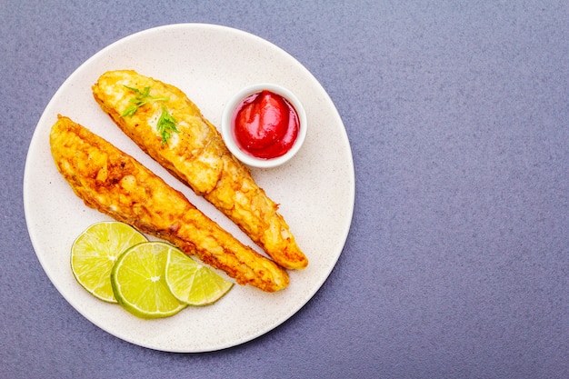 Gegrilde (gebakken) koolvis in beslag