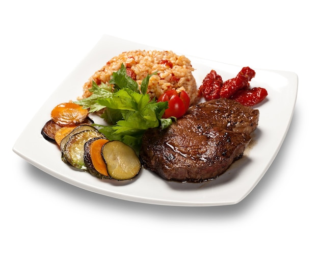 Gegrilde steak met risotto en courgette