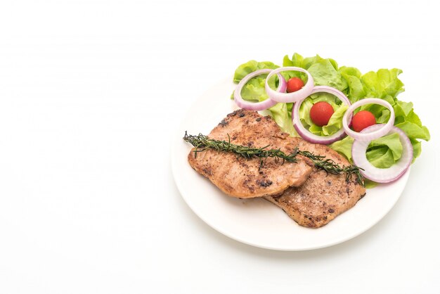 Foto gegrilde varkenssteak met groente