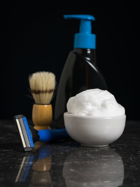 Gel for washing and shaving devices on a black background. Set for care of a man's face.