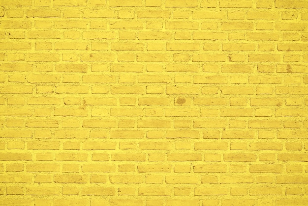 Foto gele bakstenen muur textuur achtergrond