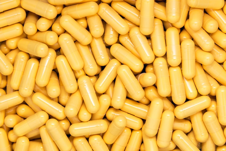 Foto gele drug capsules achtergrond