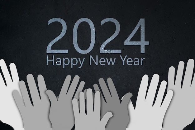 Foto gelukkig nieuwjaar 2024 met grijze papieren handen.