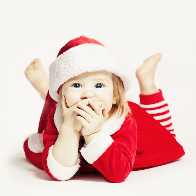 Gelukkige baby in kerstmuts. Baby Kind Lachen