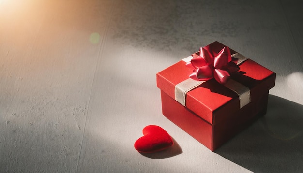 Gelukkige Valentijnsdag concept met rode geschenkdoos en hartvormige achtergrond Valentijnsscène met een r