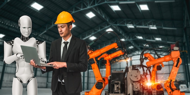 Gemechaniseerde industrierobot en menselijke arbeider die in toekomstige fabriek samenwerken