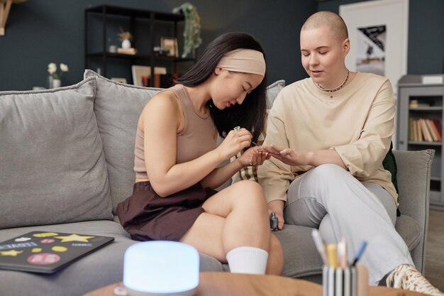 Gen z besties doing manicure at home