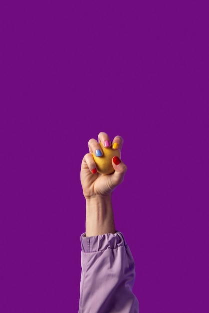 Gender fluid person hand isolated on purple