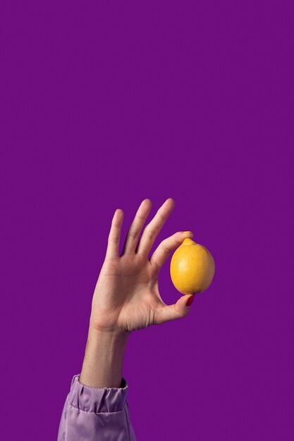 Gender fluid person hand isolated on purple