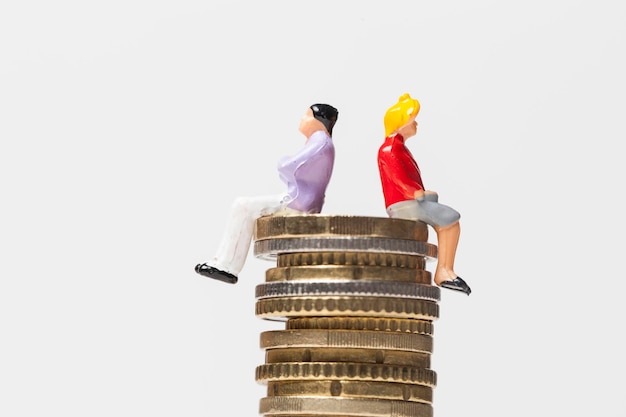 Gender pay equality concept man and woman on a stack of coins