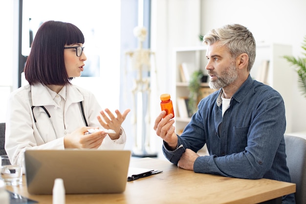 General practitioner discussing health issues with patient