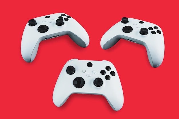 Next Generation series s robot white controllers in 3 different positions on red background.