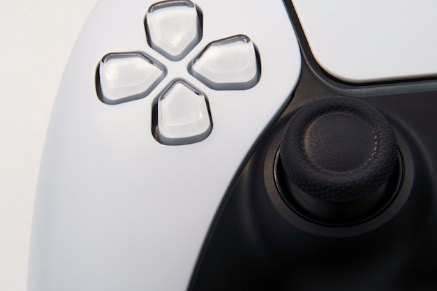 Next generation white video game controller isolated on white background. Macro close-up. Selective focus.