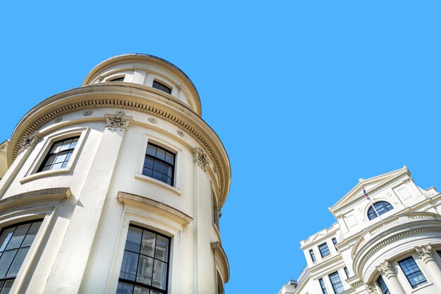 Photo generic london architecture against blue sky background with space for text