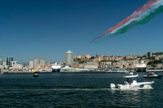 Genoa, italy - may 26 2020 - frecce tricolori italy acrobatic flight team over genoa lighthouse