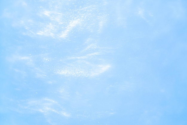 Фото Нежный синий фон с блестками волны движения жидкости
