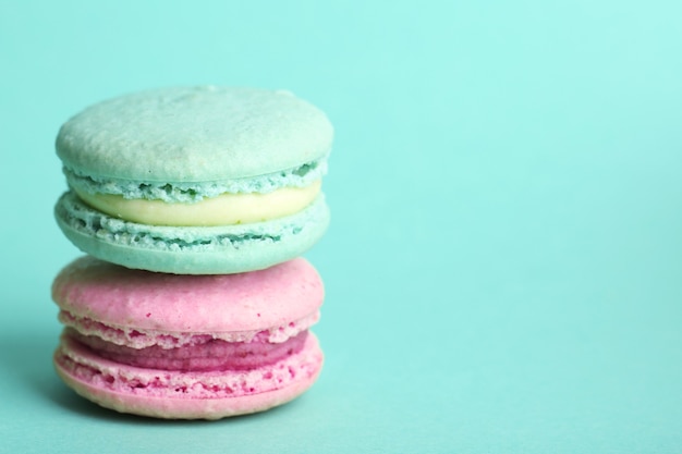 Gentle colorful macaroons on color background