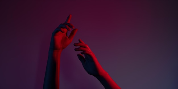 Gentle female hands in red light background. High quality photo